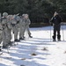 Cold-Weather Operations Course Class 18-05 students practice snowshoeing at Fort McCoy