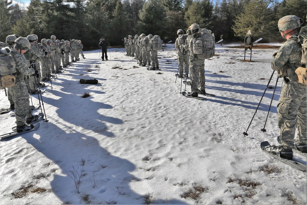 Cold-Weather Operations Course Class 18-05 students practice snowshoeing at Fort McCoy