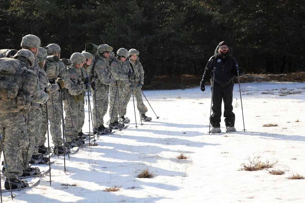 Cold-Weather Operations Course Class 18-05 students practice snowshoeing at Fort McCoy