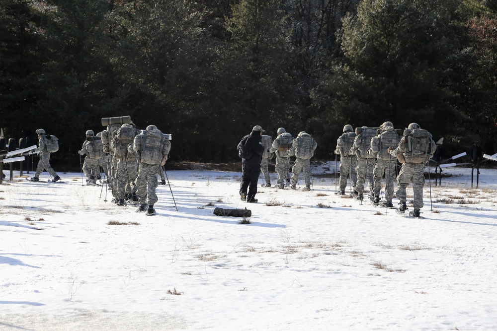 Cold-Weather Operations Course Class 18-05 students practice snowshoeing at Fort McCoy