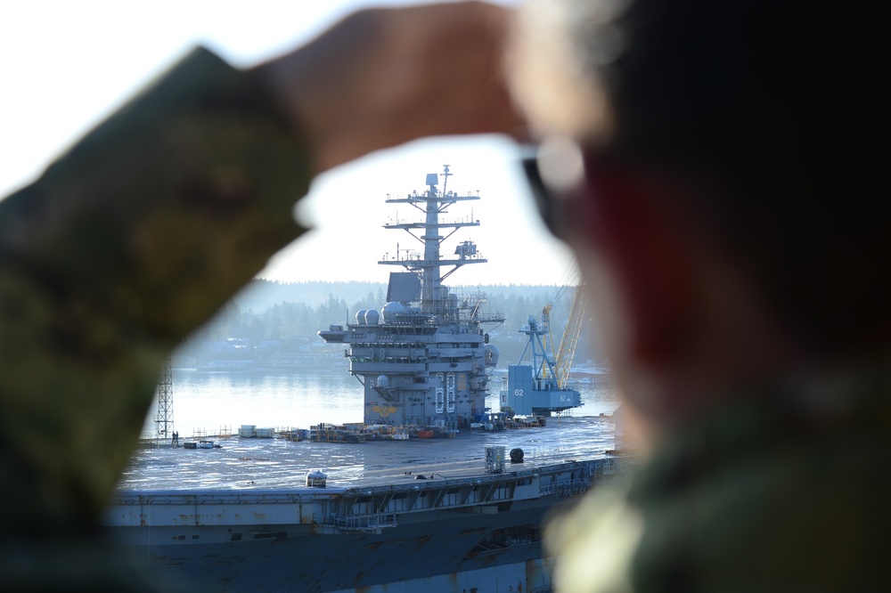 Chief Looks out on USS Nimitz (CVN 68)