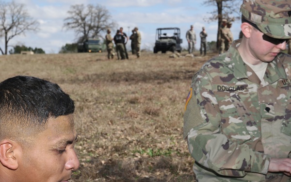 Medic Checks Texas Guardsman For Injury