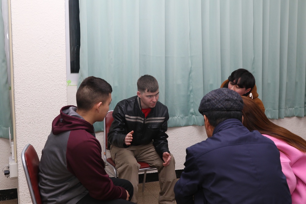 210th FA BDE Soldiers volunteer to teach English to local citizens