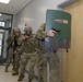 Soldiers Move Down Hallway