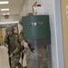 Soldier Moves to Open Door