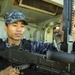 USS America Sailor inspects machine gun