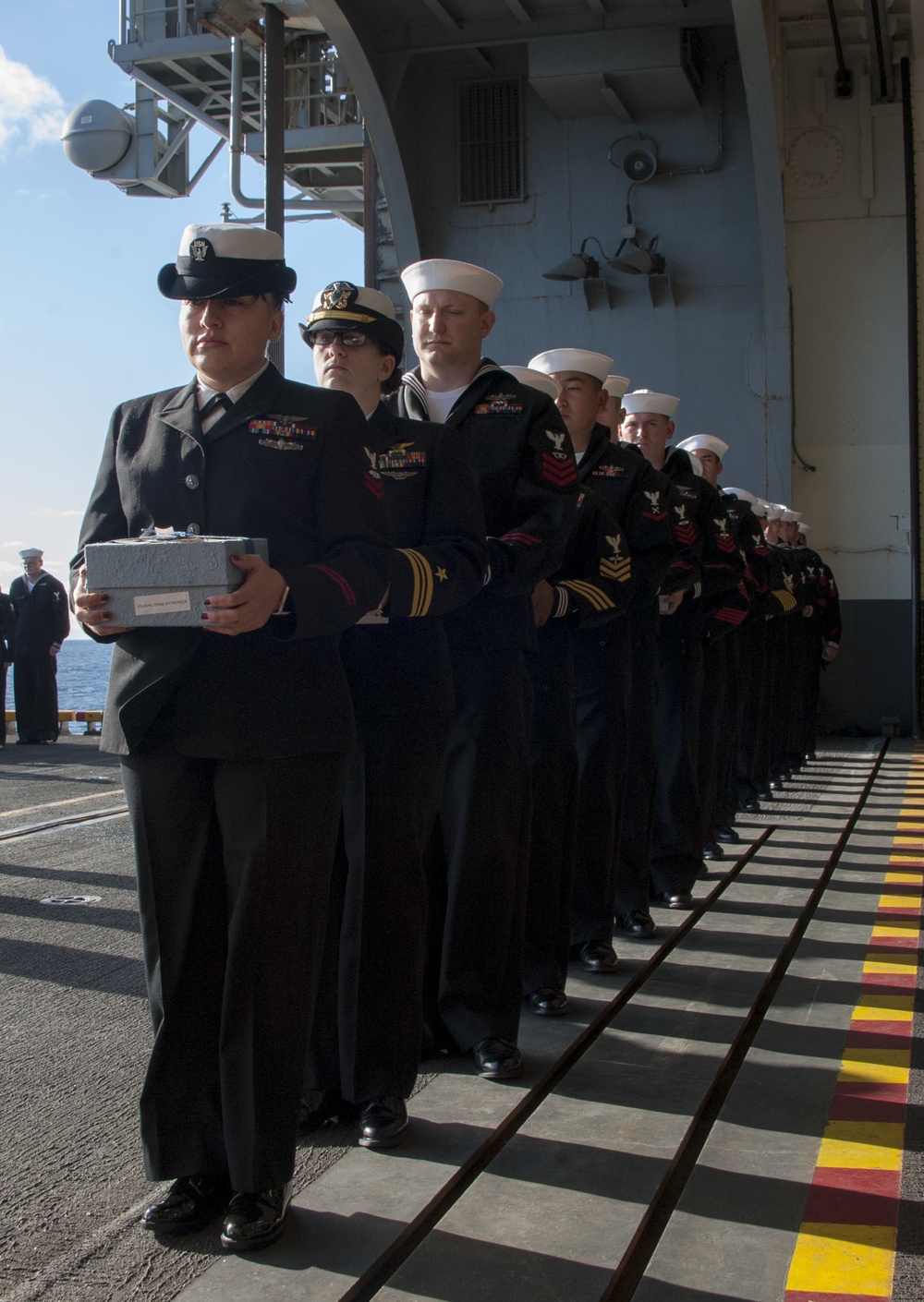 USS America (LHA 6) participate in a burial-at-sea ceremony