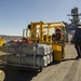 USS America Sailor moves ordnance on flight deck