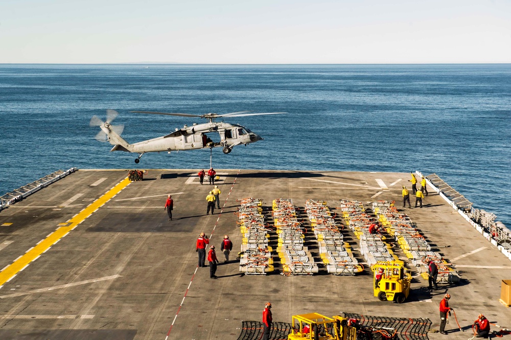USS America Sailors load ordnance on aircraft