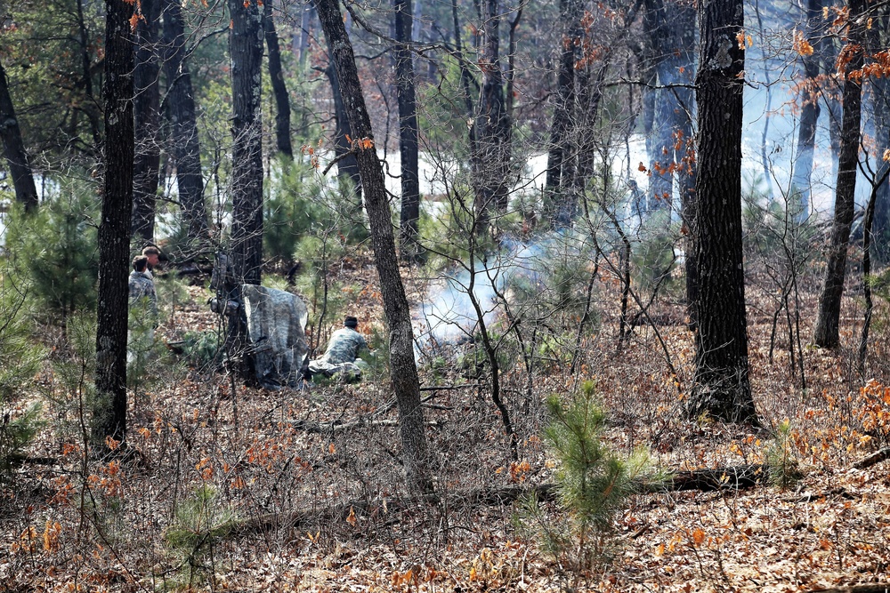 Cold-Weather Operations Course Class 18-05 students build improvised shelters at Fort McCoy