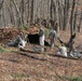 Cold-Weather Operations Course Class 18-05 students build improvised shelters at Fort McCoy