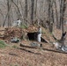 Cold-Weather Operations Course Class 18-005 students build improvised shelters at Fort McCoy