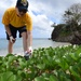 USS Mustin Sailor cleans up debris from Asan-Ma’ina beach in Guam during MultiSail 18.