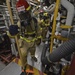 Sailors train during a main space fire drill.