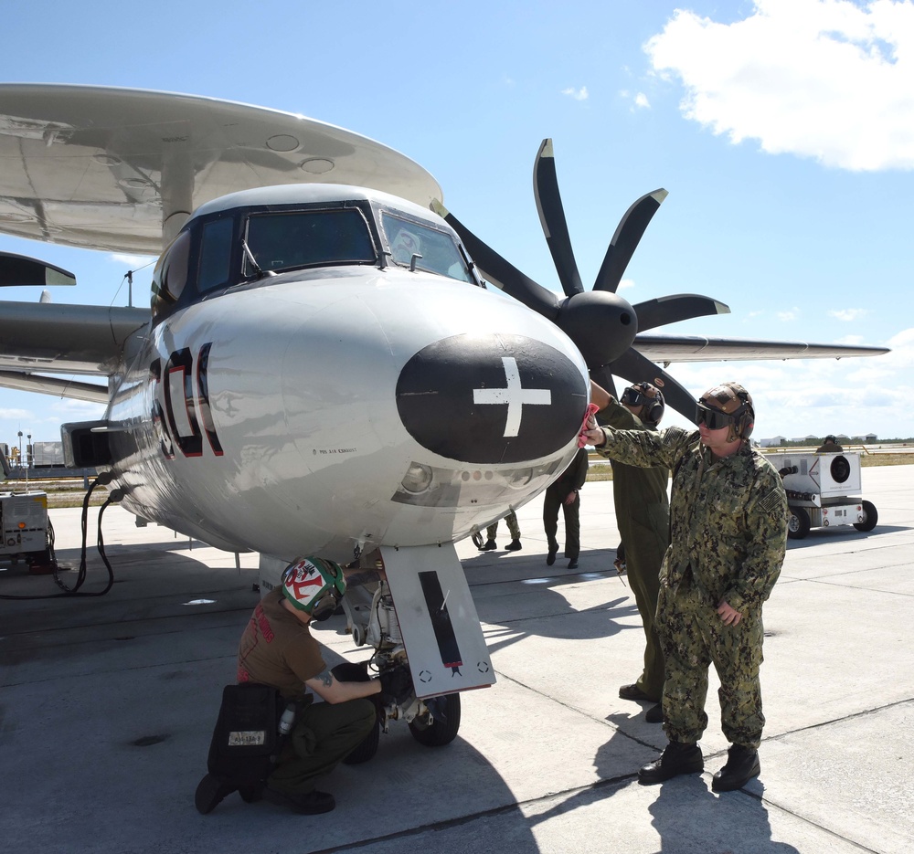 Sailors prepare a E-2C Hawkeye for flight