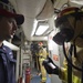 Sailors train during a main space fire drill.