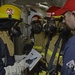 Sailors train during a main space fire drill.