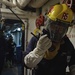 Sailors train during a main space fire drill.