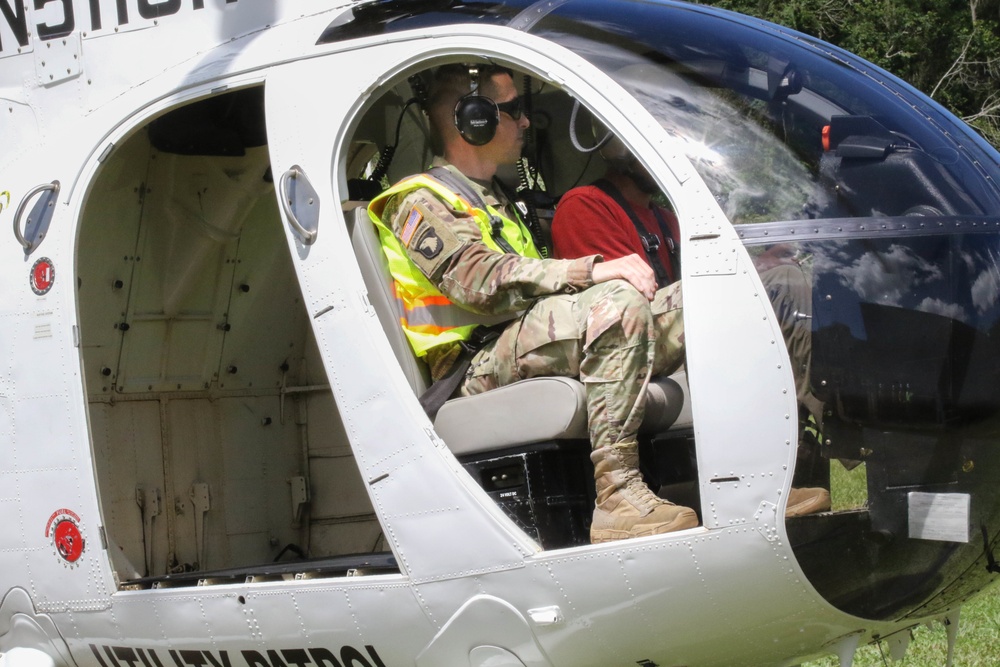 LTC Cunningham prepares to view line work from a helicoptor.