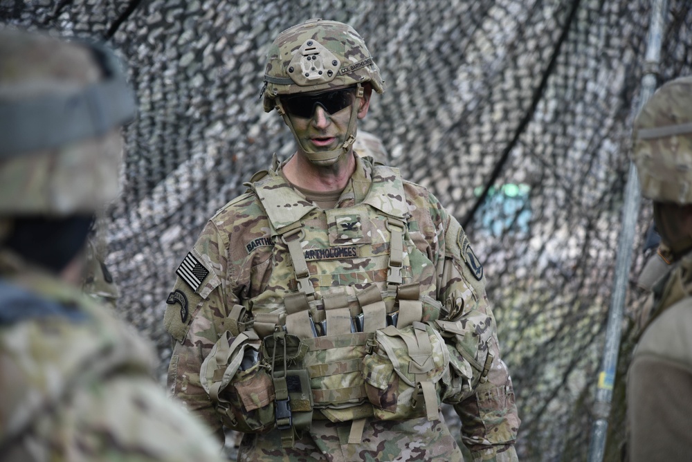 Col. James Bartholomees speaks with soldiers