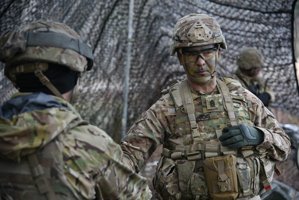 CSM Erick Ochs speaks with soldiers