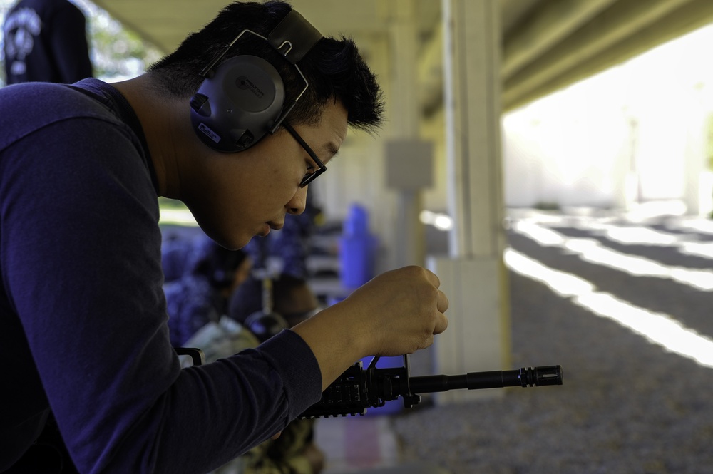 USS San Diego (LPD 22) Sailor Sights In A Rifle