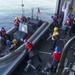 USS America Sailors lower rigid-hull inflatable boat