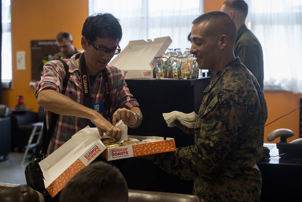 III MEF Marines and Japanese reporters ride in MV-22B Osprey