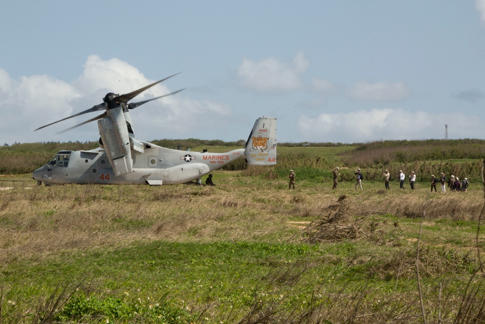 III MEF Marines and Japanese reporters ride in MV-22B Osprey
