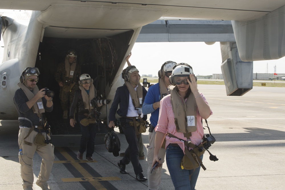III MEF Marines and Japanese reporters ride in MV-22B Osprey