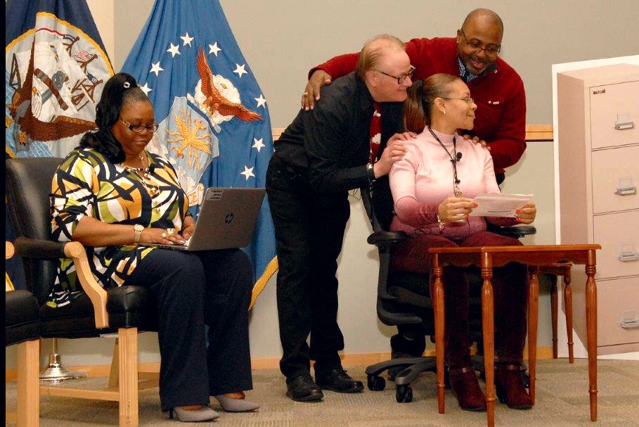 Defense Logistics Agency Troop Support employees acting out a workplace scenario to demonstrate potential sexual assault progression during a Sexual Assault Response and Prevention Summit at the DLA Troop Support.