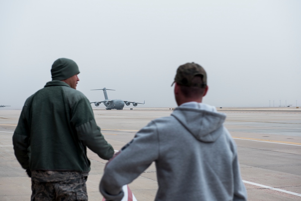 Members of the 21st Space Wing return home