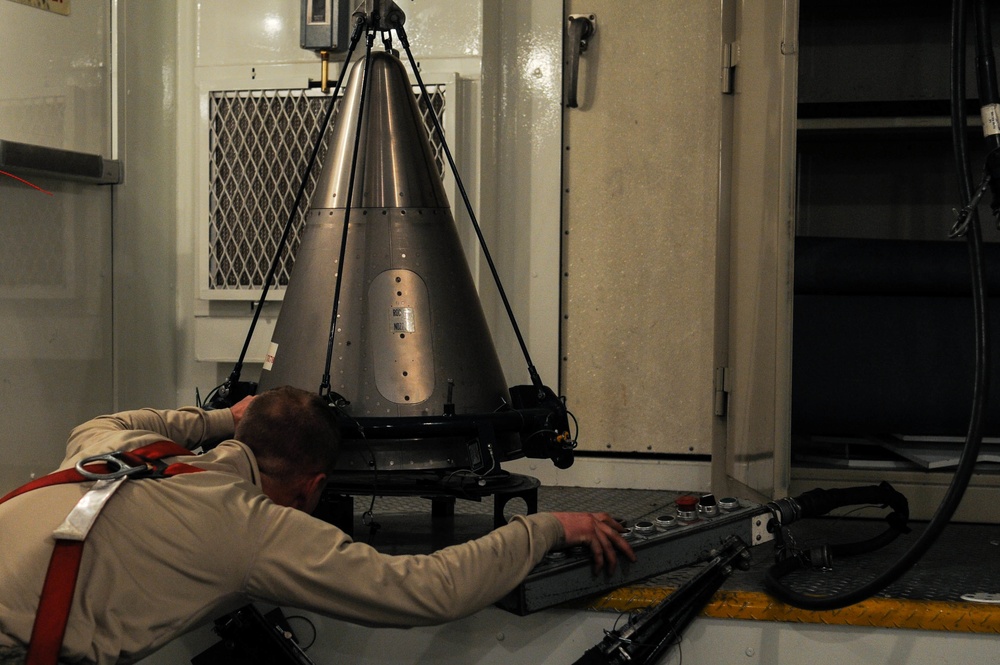 Missile maintainers tear down an ICBM for Maintenance