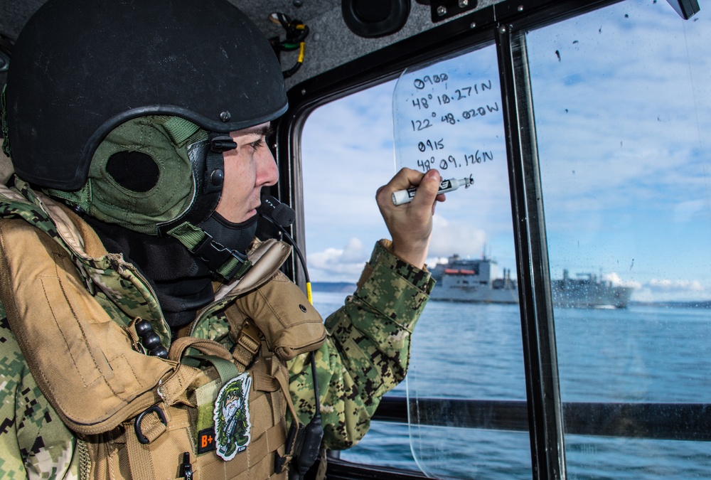 CRS 11 High Value Unit Pacific Northwest escorts USNS Charles Drew (T-AKE-10) in Puget Sound, Wash.