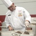 Soldier prepares meal during 43rd annual Joint Culinary Training Exercise
