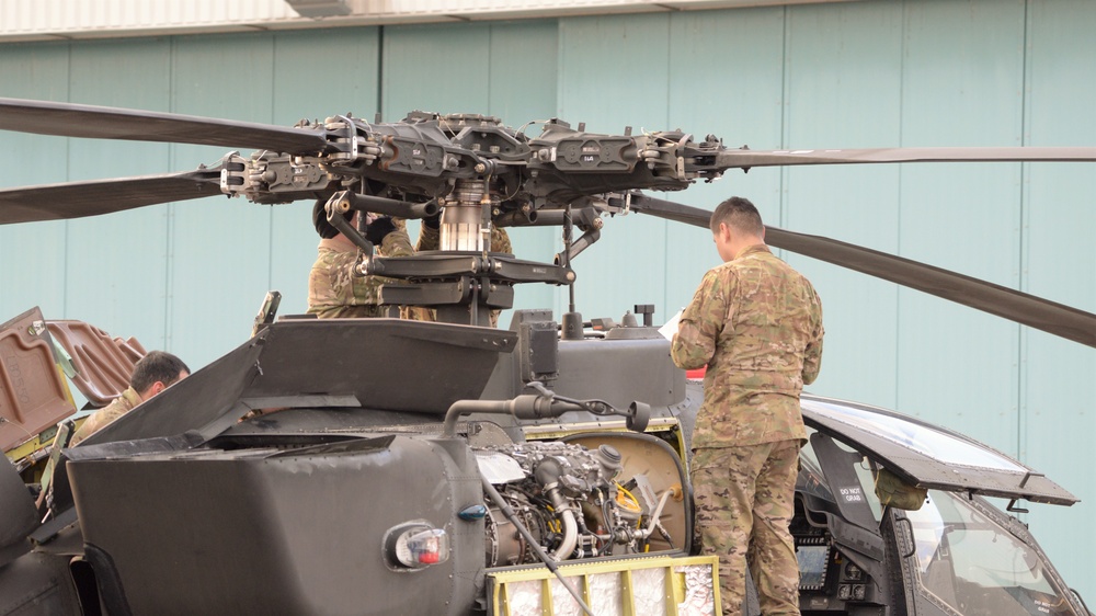 1st Battalion, 3rd Aviation Regiment (Attack Reconnaissance) conduct 500 hours phase maintenance on an AH-64D Apache