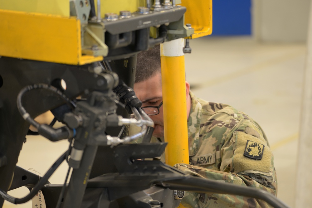 1st Battalion, 3rd Aviation Regiment (Attack Reconnaissance) conduct 500 hours phase maintenance on an AH-64D Apache