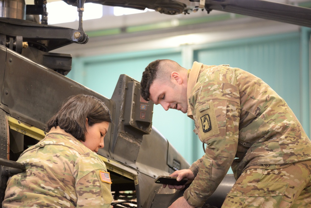 1st Battalion, 3rd Aviation Regiment (Attack Reconnaissance) conduct 500 hours phase maintenance on an AH-64 Apache