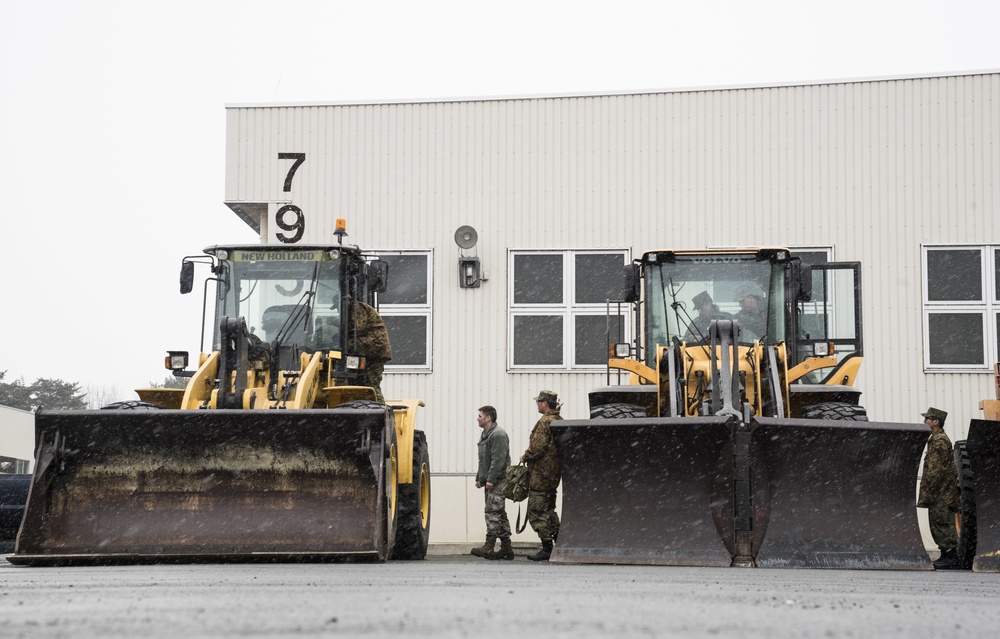 Japan Soldiers break language barriers, shadow U.S. Airmen