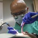 Sailors conduct a dental exam aboard USNS Mercy