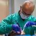 Sailors conduct a dental exam aboard USNS Mercy