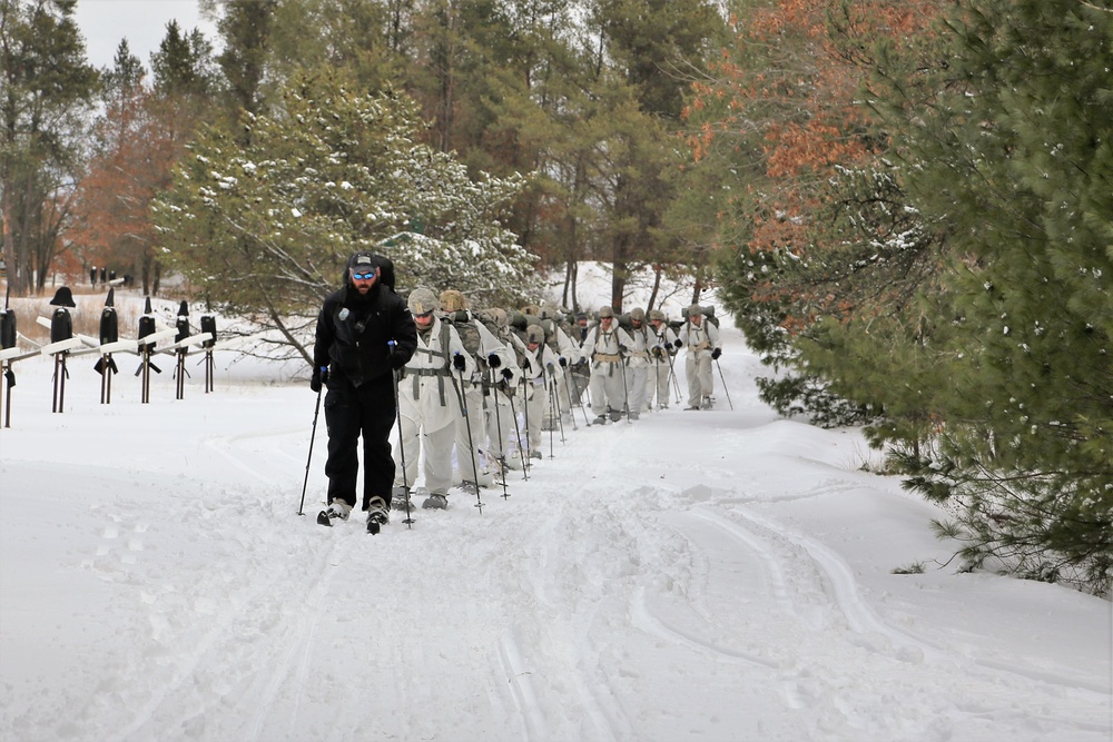 Cold-Weather Operations Course Class 18-06 students practice snowshoeing at Fort McCoy