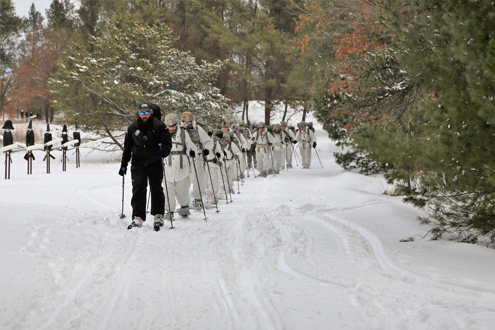 Cold-Weather Operations Course Class 18-06 students practice snowshoeing at Fort McCoy