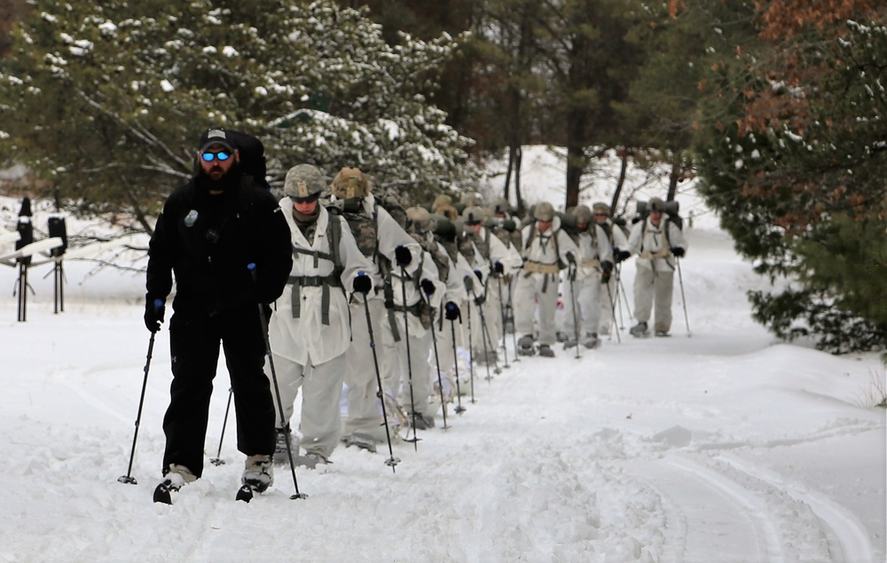 Cold-Weather Operations Course Class 18-06 students practice snowshoeing at Fort McCoy