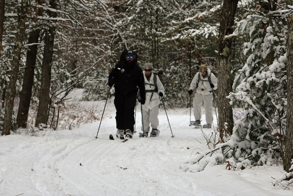 Cold-Weather Operations Course Class 18-06 students practice snowshoeing at Fort McCoy