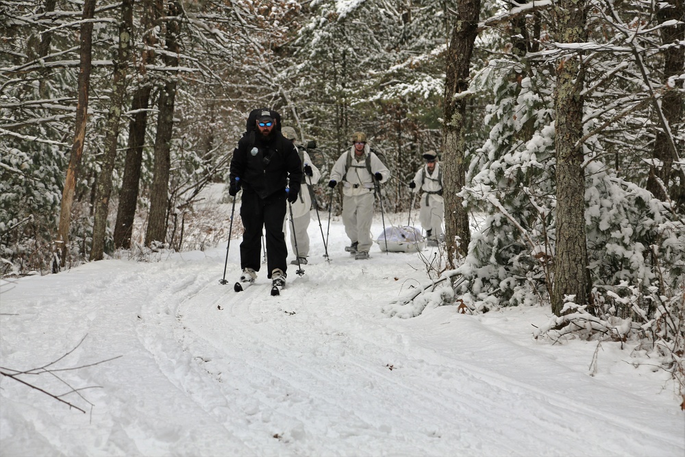 Cold-Weather Operations Course Class 18-06 students practice snowshoeing at Fort McCoy