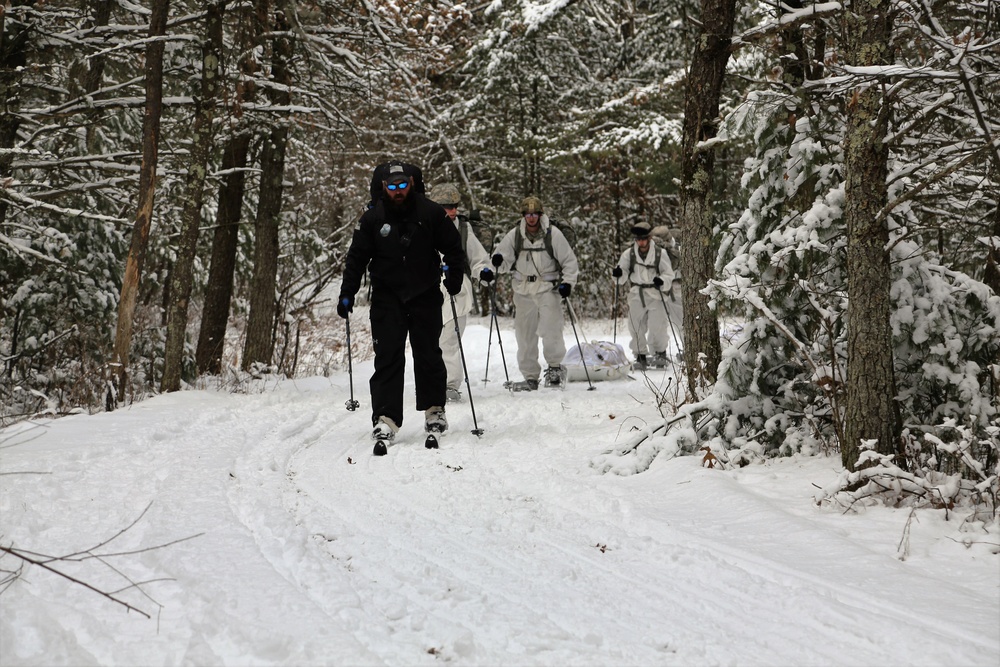 Cold-Weather Operations Course Class 18-06 students practice snowshoeing at Fort McCoy