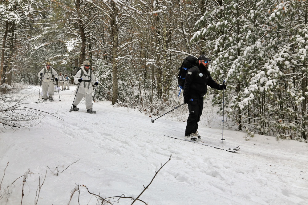 Cold-Weather Operations Course Class 18-06 students practice snowshoeing at Fort McCoy