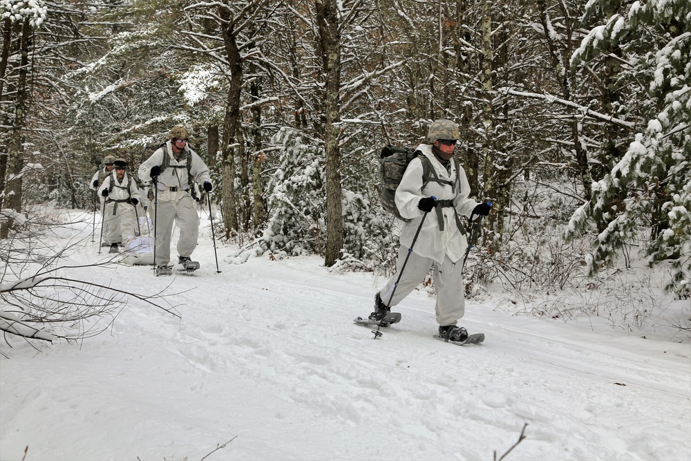 Cold-Weather Operations Course Class 18-06 students practice snowshoeing at Fort McCoy