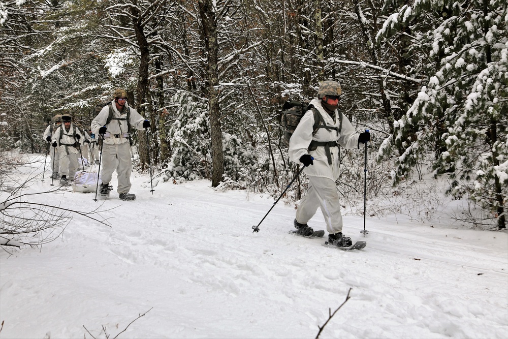 Cold-Weather Operations Course Class 18-06 students practice snowshoeing at Fort McCoy